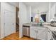 Updated kitchen with stainless appliances, bright cabinets, and open floor plan at 178 Blue Bonnet Dr, Brighton, CO 80601
