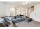 Spacious living room with open floor plan leading to dining area and kitchen at 178 Blue Bonnet Dr, Brighton, CO 80601