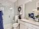 Clean bathroom with shower and tub combo, vanity with a large mirror, and updated fixtures at 4280 E Warren Ave # 1, Denver, CO 80222