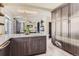 Kitchen island with seating and a view into the living room at 10778 Mountshire Cir, Highlands Ranch, CO 80126