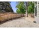 Backyard patio enclosed by a wood fence with trees at 12717 E Cornell Ave, Aurora, CO 80014