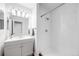 Modern bathroom featuring a bright vanity and step-in shower at 12717 E Cornell Ave, Aurora, CO 80014