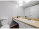 This bathroom features modern fixtures, a full vanity and sink and plenty of natural light at 12717 E Cornell Ave, Aurora, CO 80014