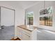 Open-concept kitchen with an island, large windows and bright, natural light and stainless steel appliances at 12717 E Cornell Ave, Aurora, CO 80014