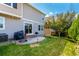 Relaxing backyard has a concrete patio, barbecue, and green lawn offering a private space for outdoor living at 3505 Dinosaur St, Castle Rock, CO 80109