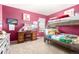 This bedroom has a bunk bed, desk, and posters at 3505 Dinosaur St, Castle Rock, CO 80109