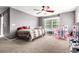 Bedroom with carpet, ceiling fan, 2 windows and a bed at 3505 Dinosaur St, Castle Rock, CO 80109