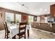 Bright dining area connected to the kitchen with lots of light and a view of the backyard, great for dining at 3505 Dinosaur St, Castle Rock, CO 80109