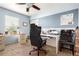 Home office with natural light, featuring a large desk with modern chair and neutral color palette at 3505 Dinosaur St, Castle Rock, CO 80109