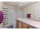 Bathroom with tub and shower combo, single vanity, and ample counter space at 11961 S Saunter Ln, Parker, CO 80138