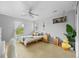 Cozy bedroom with ceiling fan, natural light, carpet, and plenty of room at 11961 S Saunter Ln, Parker, CO 80138
