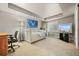 Bedroom with carpet, desk, shelving, and a tray ceiling at 11961 S Saunter Ln, Parker, CO 80138