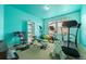 Bonus exercise room with two windows, equipment, and bright walls at 11961 S Saunter Ln, Parker, CO 80138