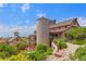 Exterior view of a community building with garden featuring stone pathway and lush, green vegetation at 11961 S Saunter Ln, Parker, CO 80138