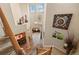 Inviting foyer with high ceilings, decorative art, and stairs leading to the upper level at 11961 S Saunter Ln, Parker, CO 80138