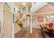 Spacious foyer featuring hardwood floors, a staircase, and views of the dining area at 11961 S Saunter Ln, Parker, CO 80138