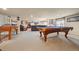Large game room with carpet, pool table, and entertainment area with large screen TV at 11961 S Saunter Ln, Parker, CO 80138