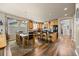 Open kitchen design with a kitchen island, stainless steel appliances, and wood cabinetry at 11961 S Saunter Ln, Parker, CO 80138