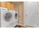 Laundry room with new washer and dryer, and additional storage space at 11961 S Saunter Ln, Parker, CO 80138