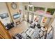 Aerial view of a modern living room with a fireplace, comfortable seating, and outdoor access at 11961 S Saunter Ln, Parker, CO 80138