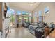Bright living room showcasing large windows, comfortable seating, and backyard views at 11961 S Saunter Ln, Parker, CO 80138