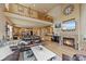 Inviting open-concept living room with a fireplace and hardwood floors at 11961 S Saunter Ln, Parker, CO 80138