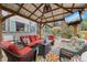 Relaxing outdoor patio with covered pergola, comfortable seating, and outdoor television at 11961 S Saunter Ln, Parker, CO 80138