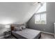 Well-lit bedroom with vaulted ceilings, large window, and neutral decor at 5250 S Huron Way # 13-312, Littleton, CO 80120