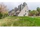 Exterior view of multi-level townhomes with modern architectural design and well-manicured lawn at 5250 S Huron Way # 13-312, Littleton, CO 80120
