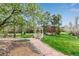 Landscaped community gazebo surrounded by lush greenery, trees and a stone pathway at 5250 S Huron Way # 13-312, Littleton, CO 80120