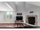 Large living room with a cozy fireplace, hardwood floors and lots of natural light at 5250 S Huron Way # 13-312, Littleton, CO 80120