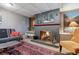 Finished basement rec room with a fireplace and comfortable seating at 2872 S Zenobia St, Denver, CO 80236