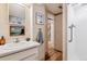 Basement bathroom with shower and updated vanity at 2872 S Zenobia St, Denver, CO 80236