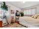 Cozy bedroom with a queen-size bed, large windows, and a neutral color palette at 2872 S Zenobia St, Denver, CO 80236