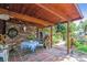 Covered patio with brick flooring and outdoor seating at 2872 S Zenobia St, Denver, CO 80236