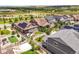 Expansive aerial view features a home with solar panels, and a beautiful backyard area at 8056 Piney River Ave, Littleton, CO 80125