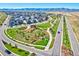 An aerial view showcases a well-planned community with green spaces, roadways, and thoughtfully placed amenities at 8056 Piney River Ave, Littleton, CO 80125