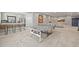 Finished basement with a ping pong table, bar area, and cozy seating, perfect for entertaining and recreation at 8056 Piney River Ave, Littleton, CO 80125