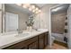 Well-lit bathroom with double sinks, and a mirror, offering functionality at 8056 Piney River Ave, Littleton, CO 80125