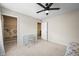 Bright bedroom with desk and walk-in closet featuring colorful world map at 8056 Piney River Ave, Littleton, CO 80125