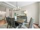 Dining room featuring a wooden table, chandelier lighting, and neutral color palette, perfect for entertaining at 8056 Piney River Ave, Littleton, CO 80125