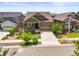 Charming home featuring a landscaped front yard and a welcoming front porch at 8056 Piney River Ave, Littleton, CO 80125