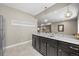 Kitchenette with granite countertop and stainless steel refrigerator adjacent to recreational space at 8056 Piney River Ave, Littleton, CO 80125