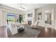 An inviting living room with a fireplace, ample seating, and sliding glass doors that provide plenty of natural light at 8056 Piney River Ave, Littleton, CO 80125