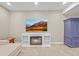 Cozy living room features a fireplace, television, and comfortable seating at 8056 Piney River Ave, Littleton, CO 80125