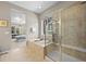 Luxurious main bathroom featuring a soaking tub, and a glass-enclosed shower at 8056 Piney River Ave, Littleton, CO 80125