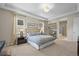 Bright and airy main bedroom with a luxurious bed, and ample natural light at 8056 Piney River Ave, Littleton, CO 80125