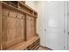 Functional mudroom featuring a built-in bench, storage shelves, and convenient hooks for organizing outerwear at 8056 Piney River Ave, Littleton, CO 80125