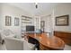 Well-lit home office with a wooden desk, shelving, and neutral decor creating a professional workspace at 8056 Piney River Ave, Littleton, CO 80125