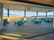 Inviting outdoor patio with tables and chairs, perfect for enjoying panoramic views at 8056 Piney River Ave, Littleton, CO 80125